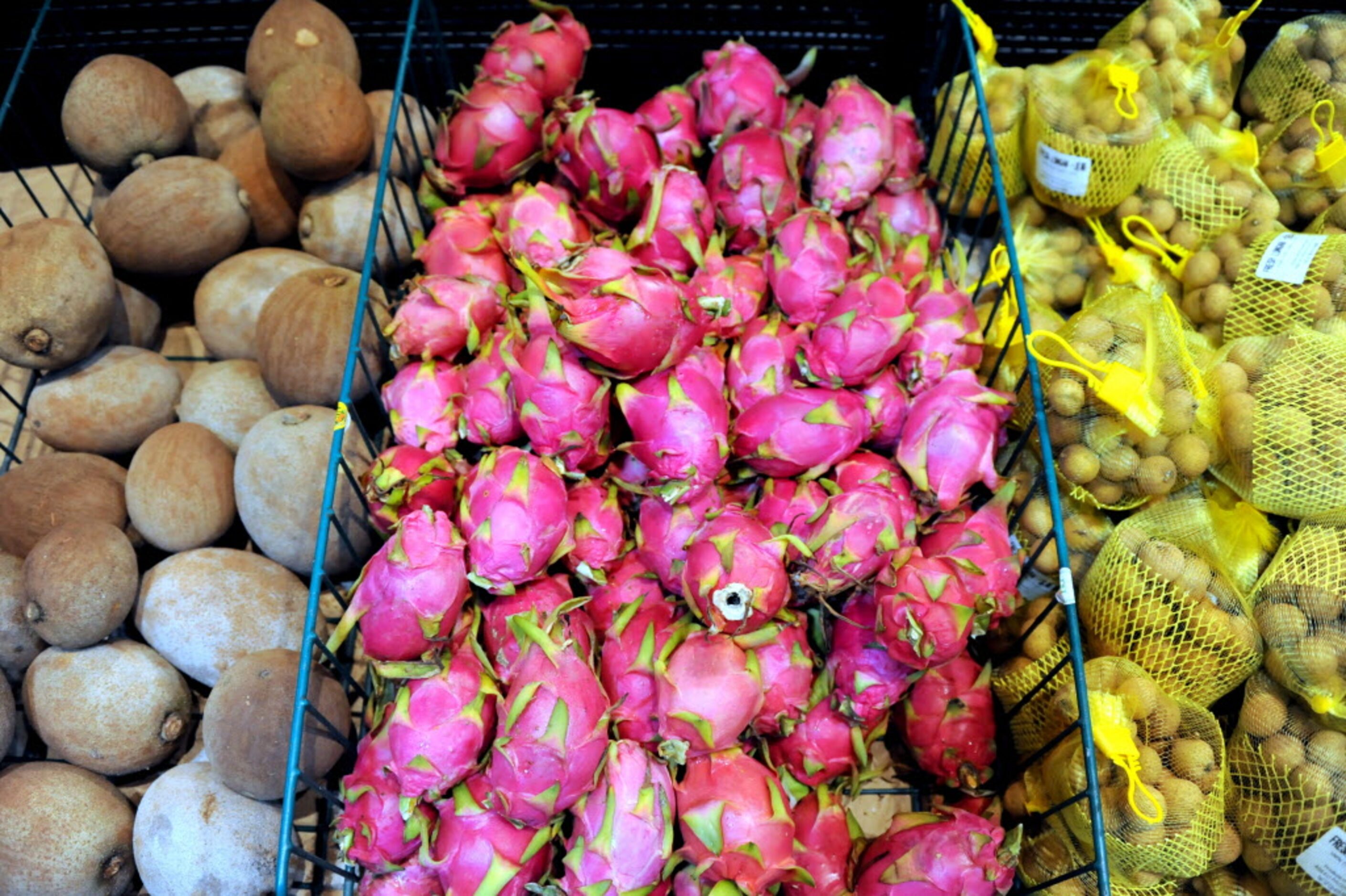 The produce section features fresh fruits like Ma Mey Sapote, Dragon Fruit, and Longan at H...