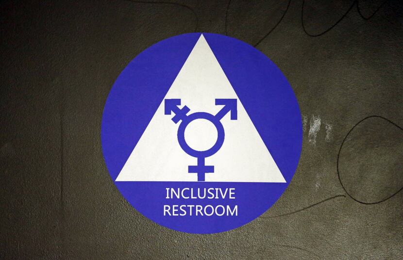 A sticker designates a gender neutral bathroom at Nathan Hale High School in Seattle. This...