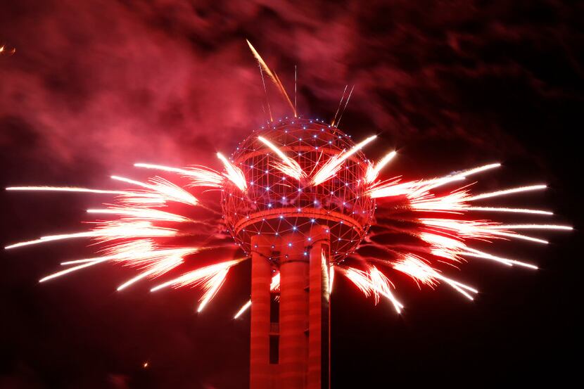 Fireworks fly from Reunion Tower during the New Year's Eve event in Dallas on Dec. 31, 2016.