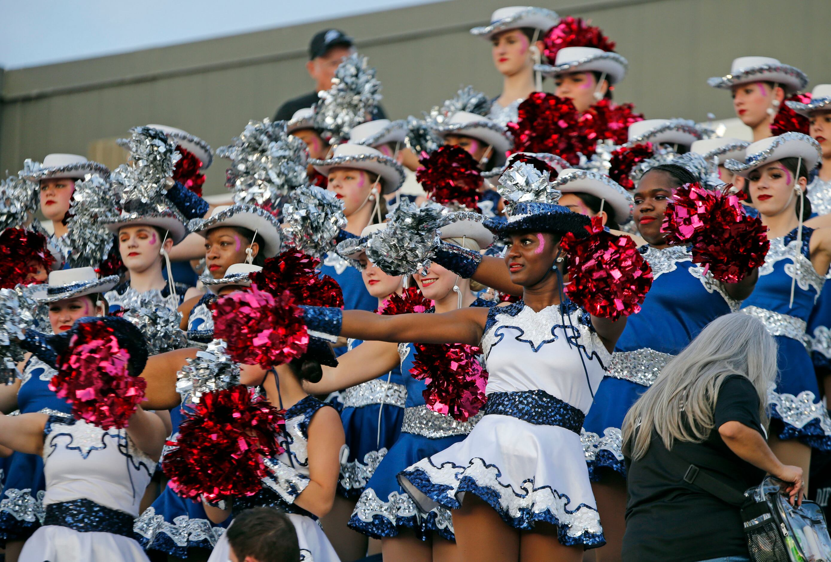 The Wylie East drill team performs in the stands during the first half of a high school...