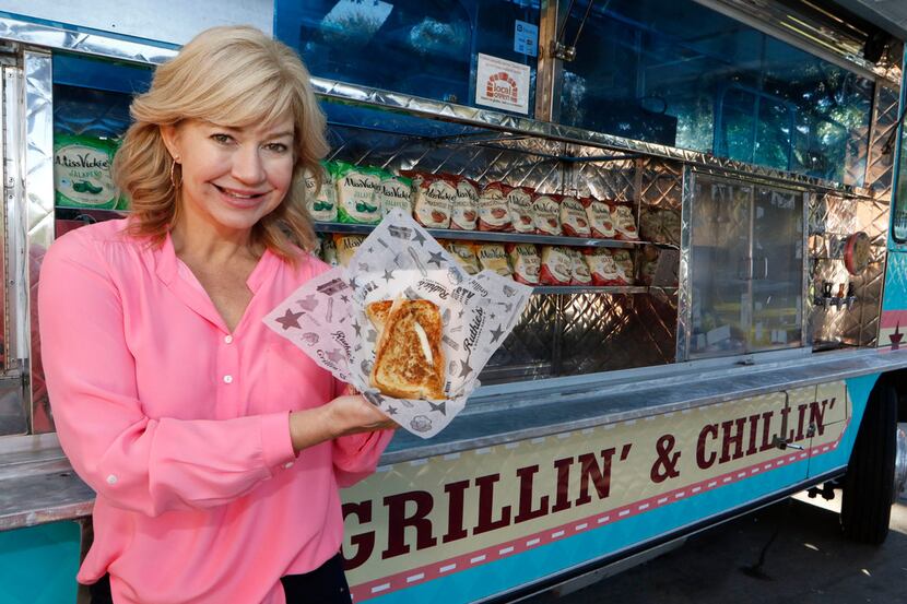 Ashlee Kleinert, daughter of Dallas billionaire Ray Hunt, holds one of her famous grilled...