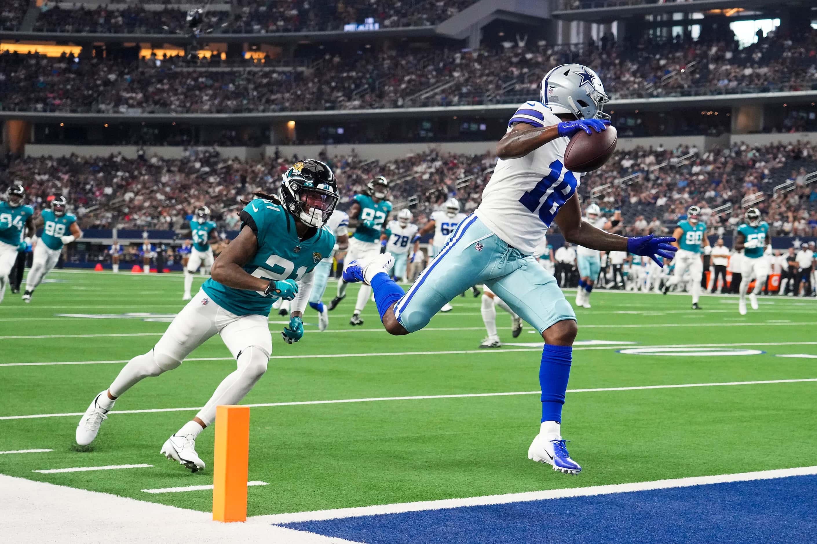 Dallas Cowboys wide receiver Aaron Parker (18) scores on a 19-yard touchdown  reception past...