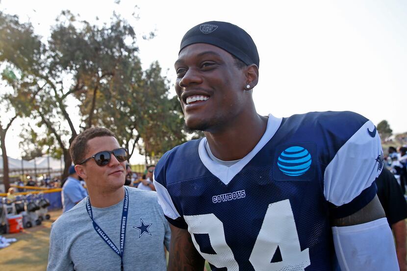 Cowboys defensive end Randy Gregory walks off the field after an afternoon practice at...