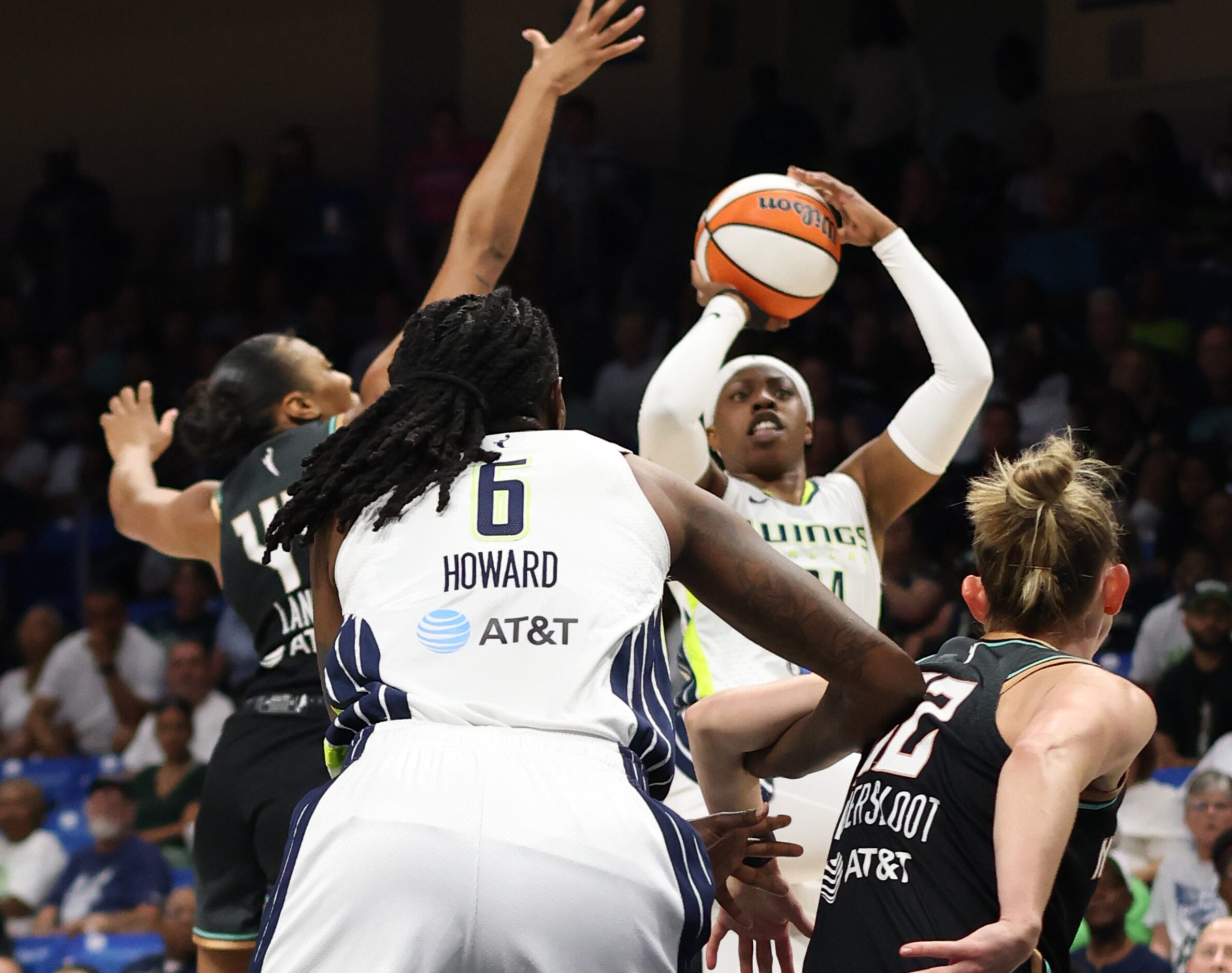 Dallas Wings guard Arike Ogunbowale (24) puts up a long range shot during first half action...