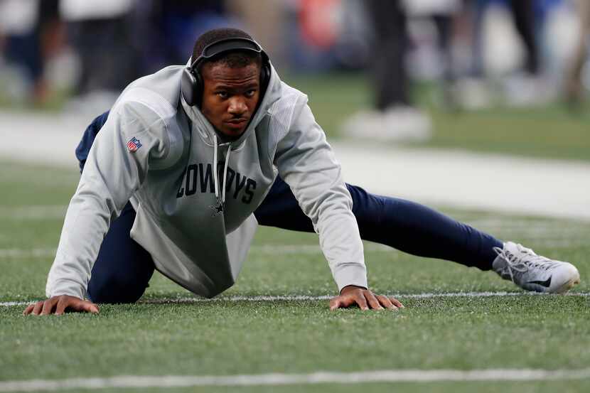 Dallas Cowboys linebacker Micah Parsons (11) warms up before an NFL football game against...