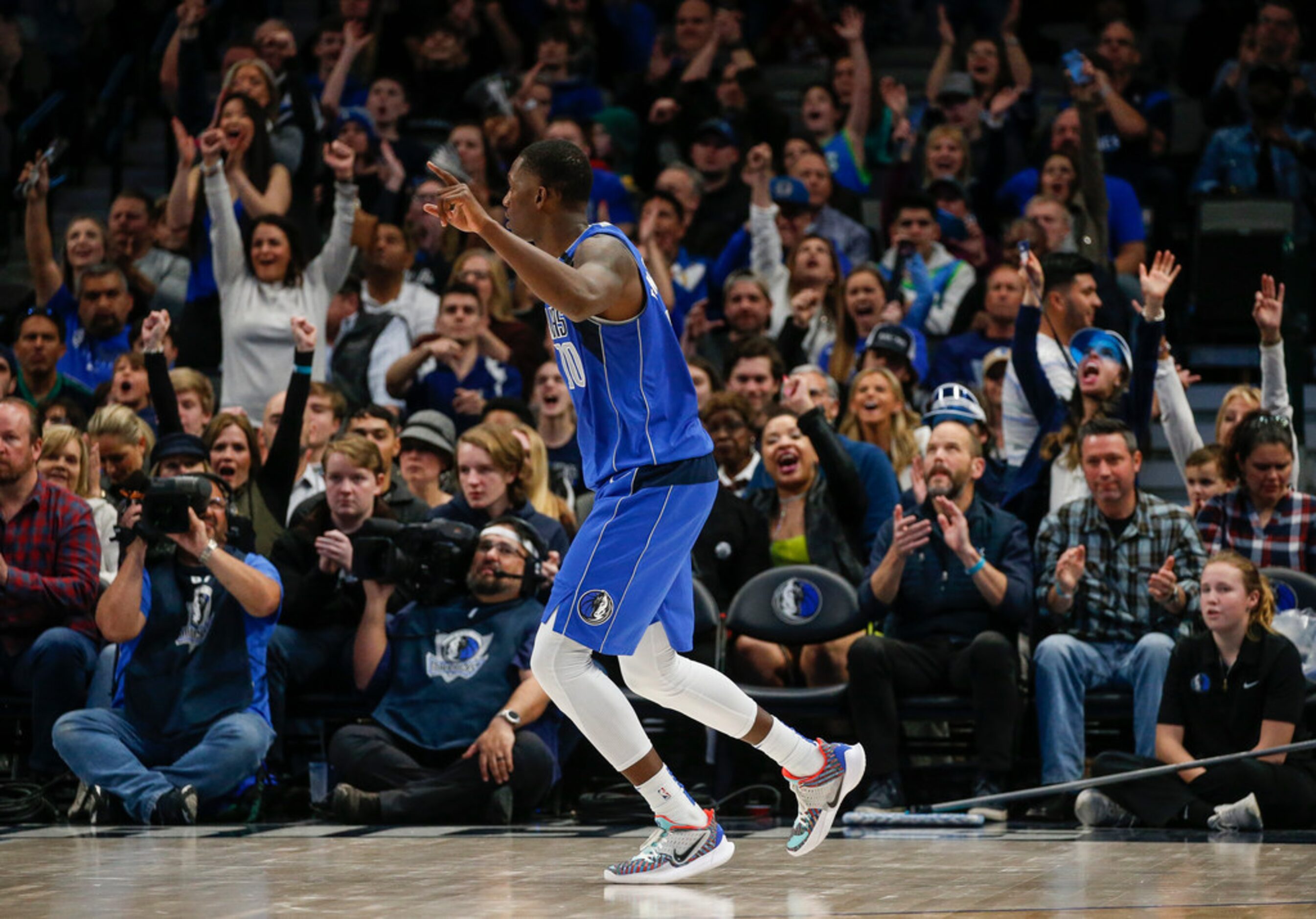 Dallas Mavericks forward Dorian Finney-Smith (10) celebrates scoring during overtime in a...