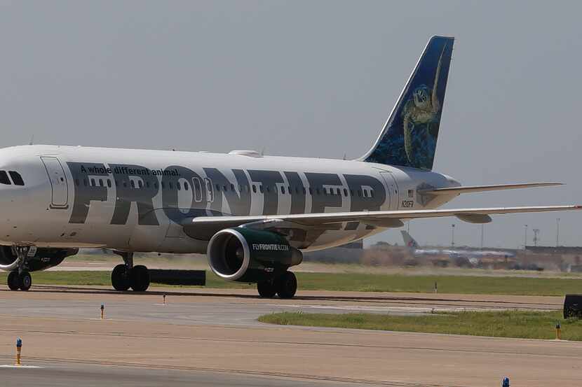 A Frontier Airlines A320 taxis at DFW International Airport.