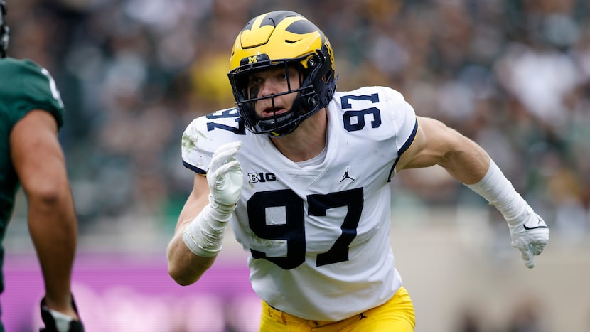 Michigan's Aidan Hutchinson plays during an NCAA college football game against Michigan...