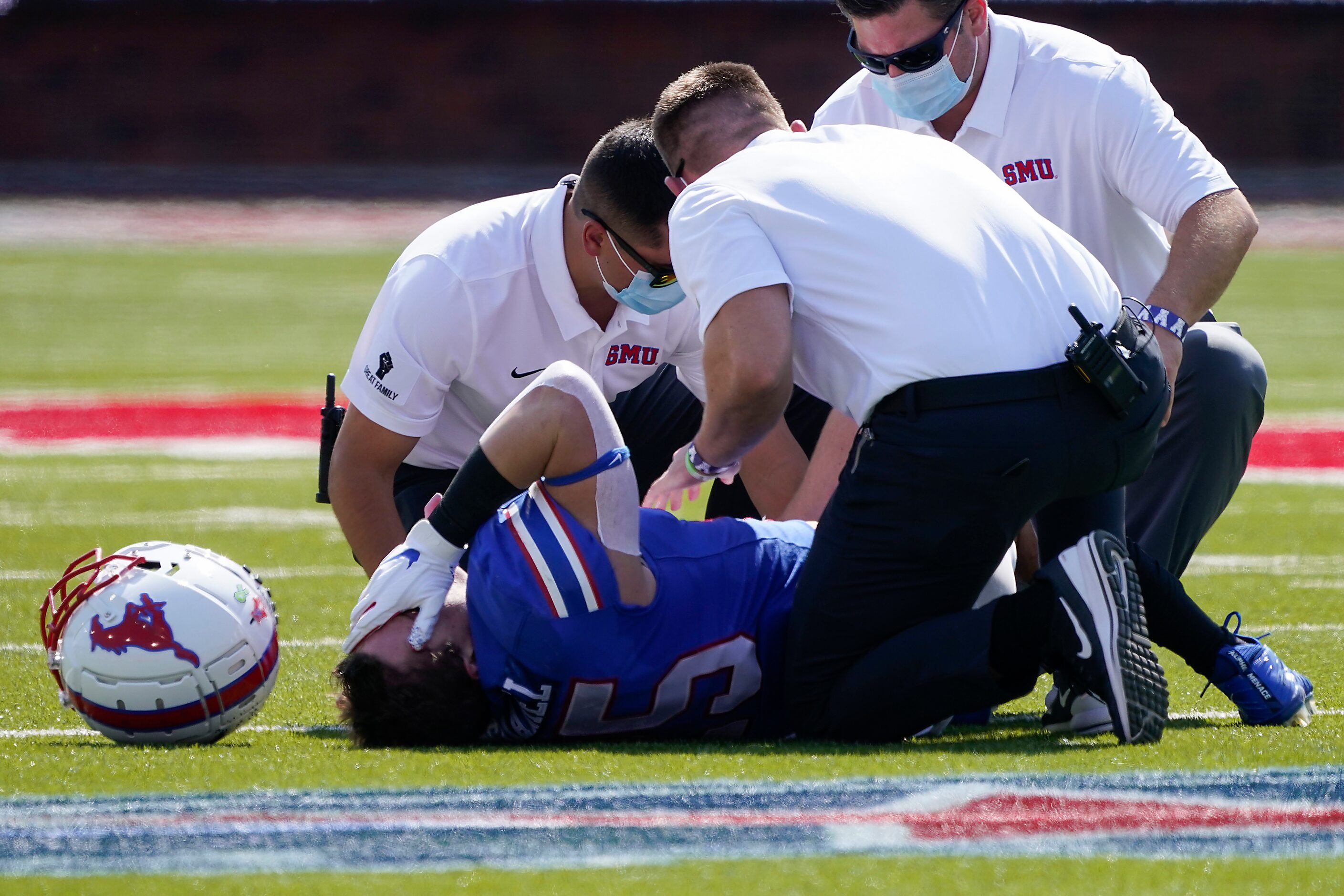 SMU running back TJ McDaniel recieves attention after being injured during the first half of...