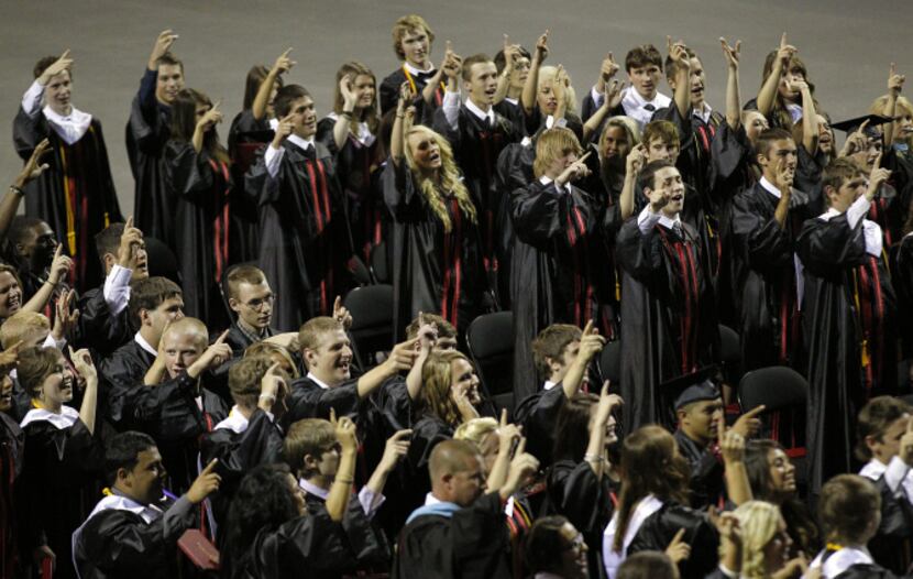 West High seniors sang their school song to conclude their graduation ceremony at the...