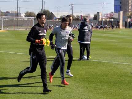 Michael Collodi (center, gray top) jogs with JImmy Maurer and Kyle Zobeck in FCD training....