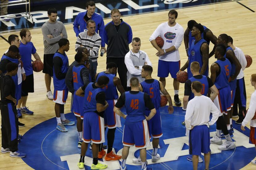 Florida head coach Billy Donovan, speaks to players during practice at the NCAA college...