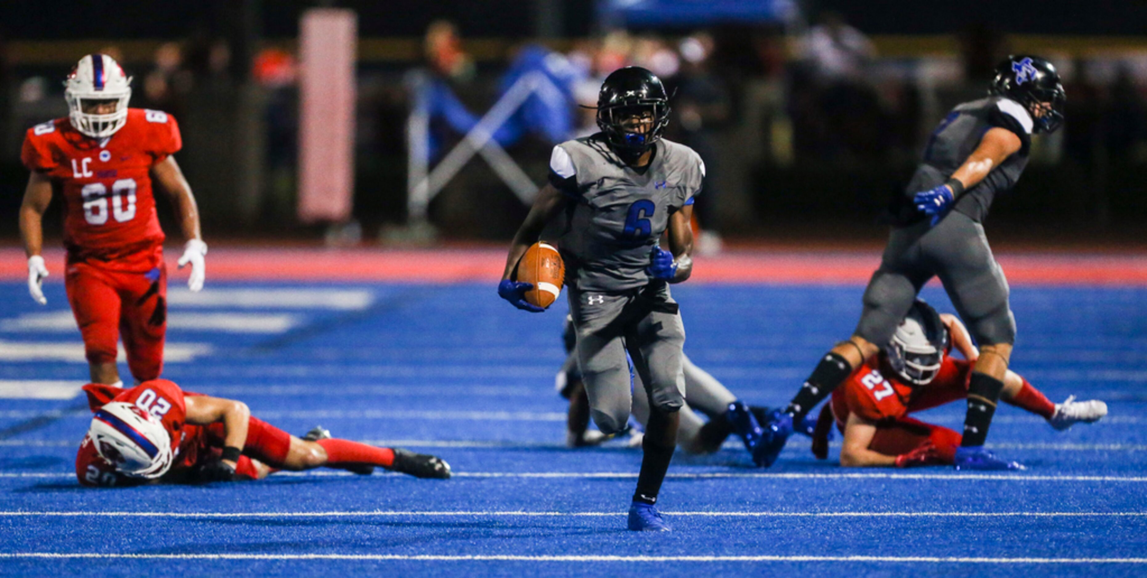 Trinity Christian-Cedar Hill's Cameron Wilson (6) makes a run during a high school football...