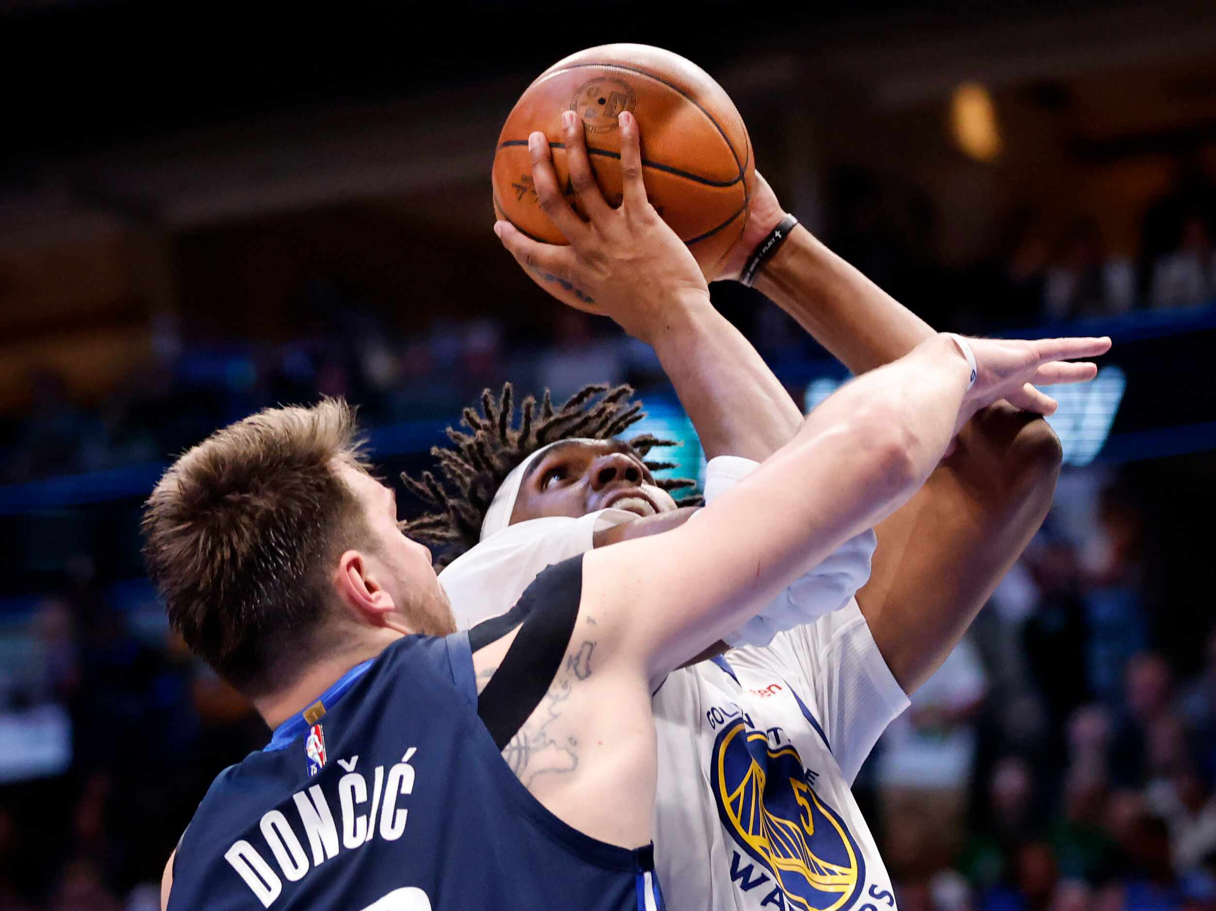 Dallas Mavericks guard Luka Doncic (77) tries to block a shot by by Golden State Warriors...