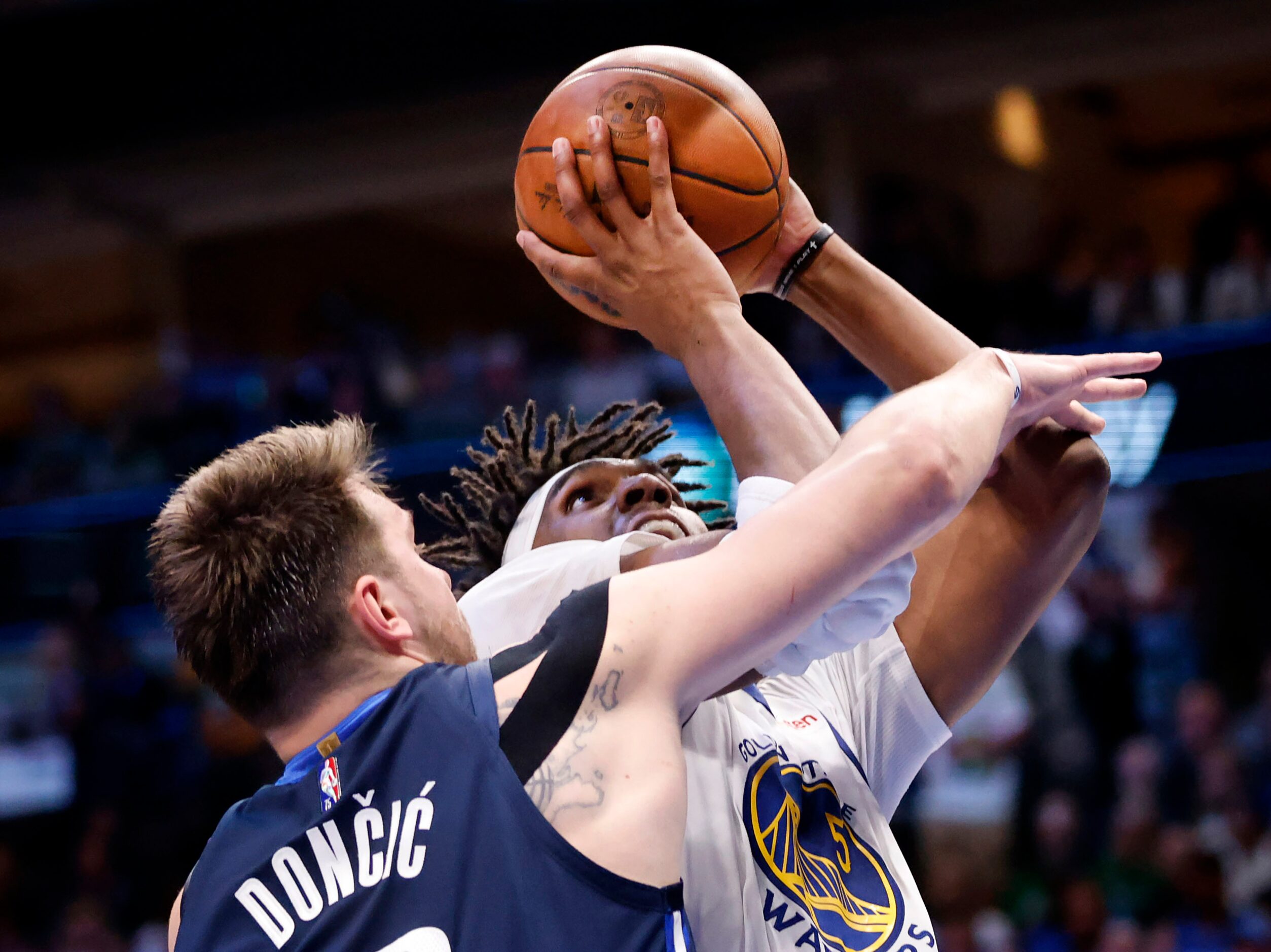 Dallas Mavericks guard Luka Doncic (77) tries to block a shot by by Golden State Warriors...