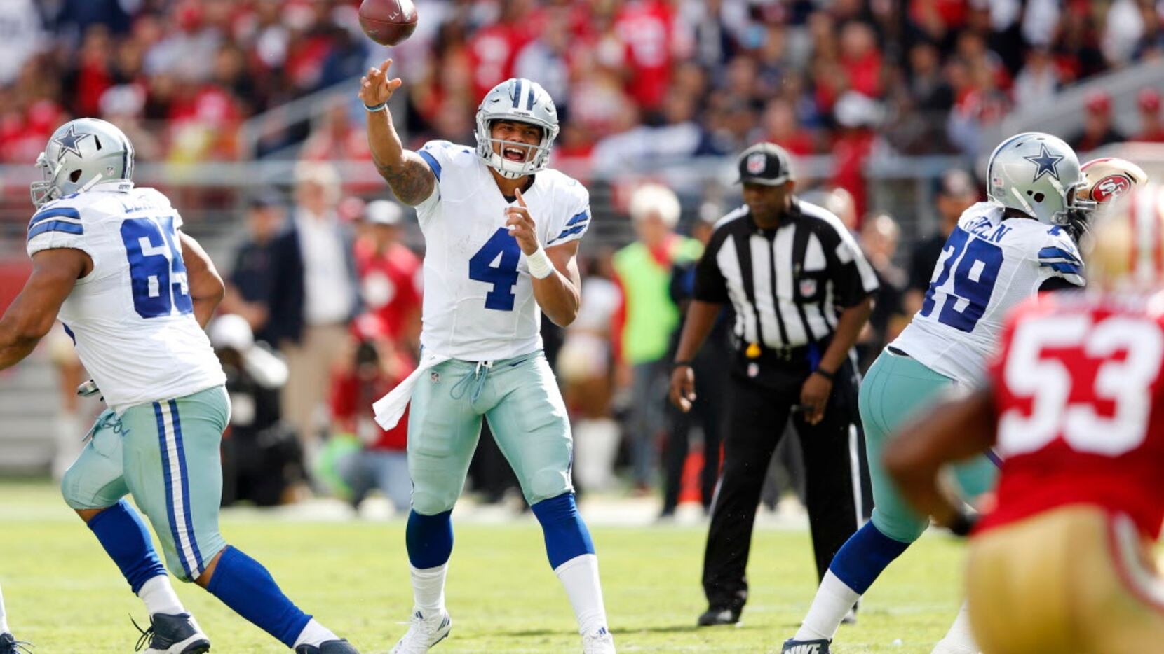 Dallas Cowboys quarterback Dak Prescott (4) attempts and completes a pass to Dallas Cowboys...