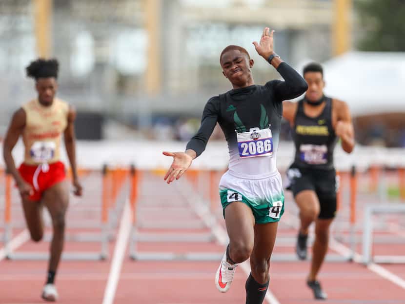 Mesquite Poteet's Kendrick Smallwood claps as he finishes first in the 5A Boys 110 meter...