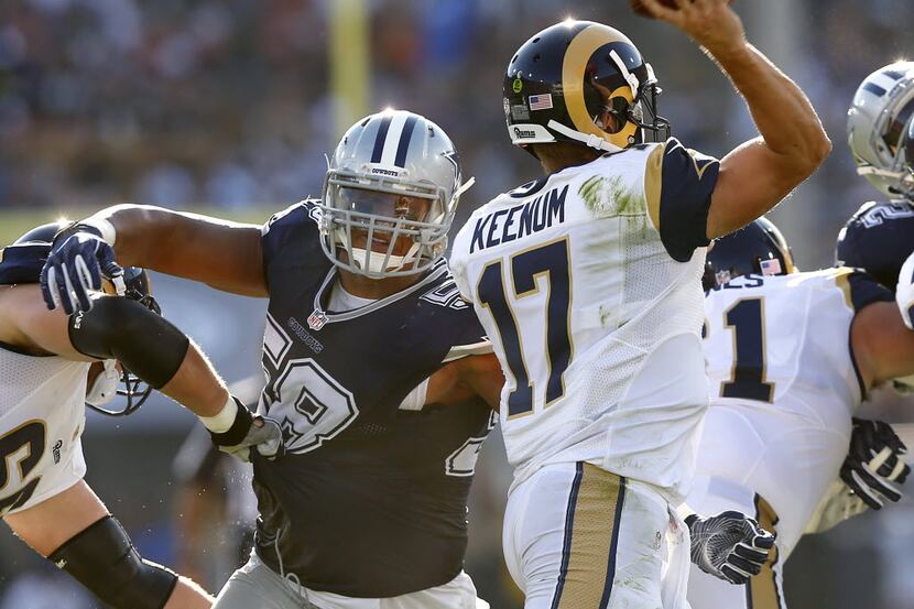 Dallas Cowboys defensive end Jack Crawford (58) pass rushes Los Angeles Rams quarterback...