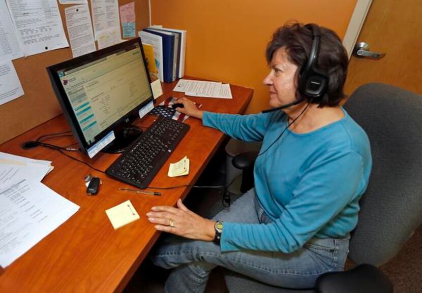 
Parker resident Sharon MacDuff works the phone lines as a volunteer at the Assistance...
