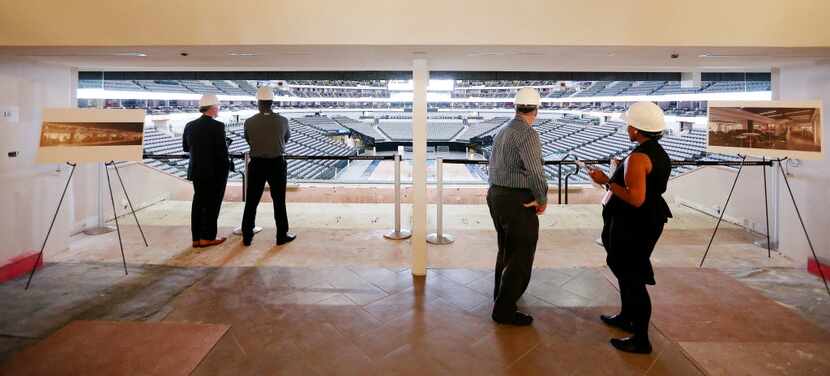 Guests tour inside the unfinished CyrusOne Club loge boxes at American Airlines Center in...