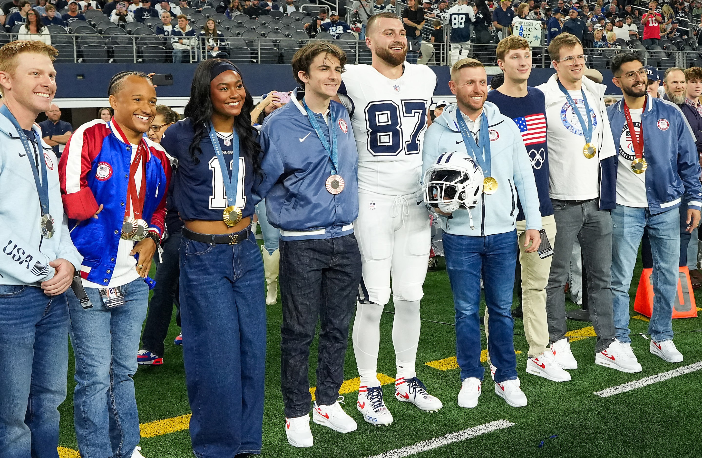 Dallas Cowboys tight end Jake Ferguson (87) poses for a photo with 2024 Olympians and...