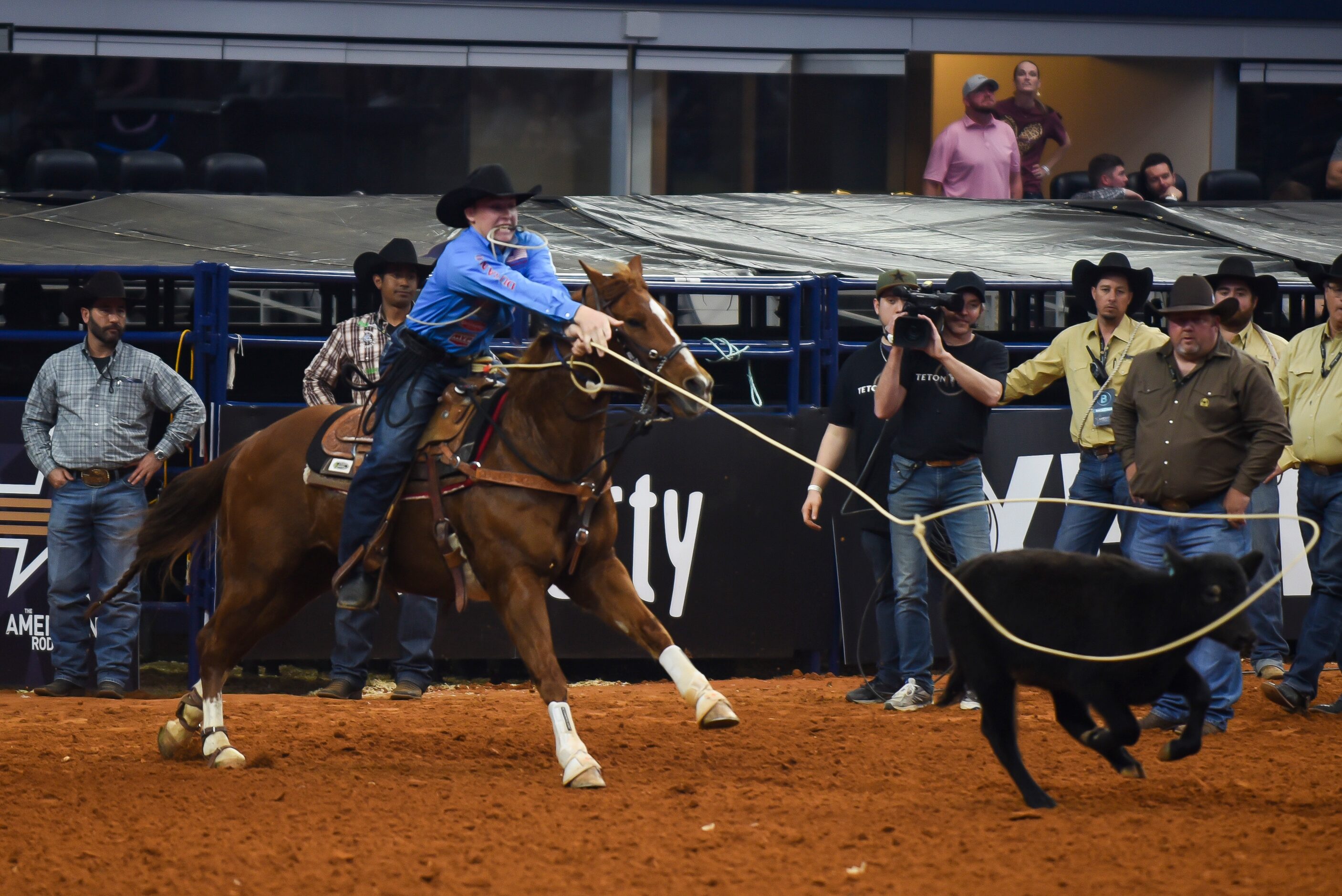 Riley Webb attempts to rope a cattle as a part of the Tie Down Roping event during the...