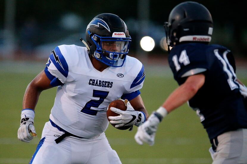 Dallas Christian School running back Marcus Knox (2) looks for room to get by Episcopal...