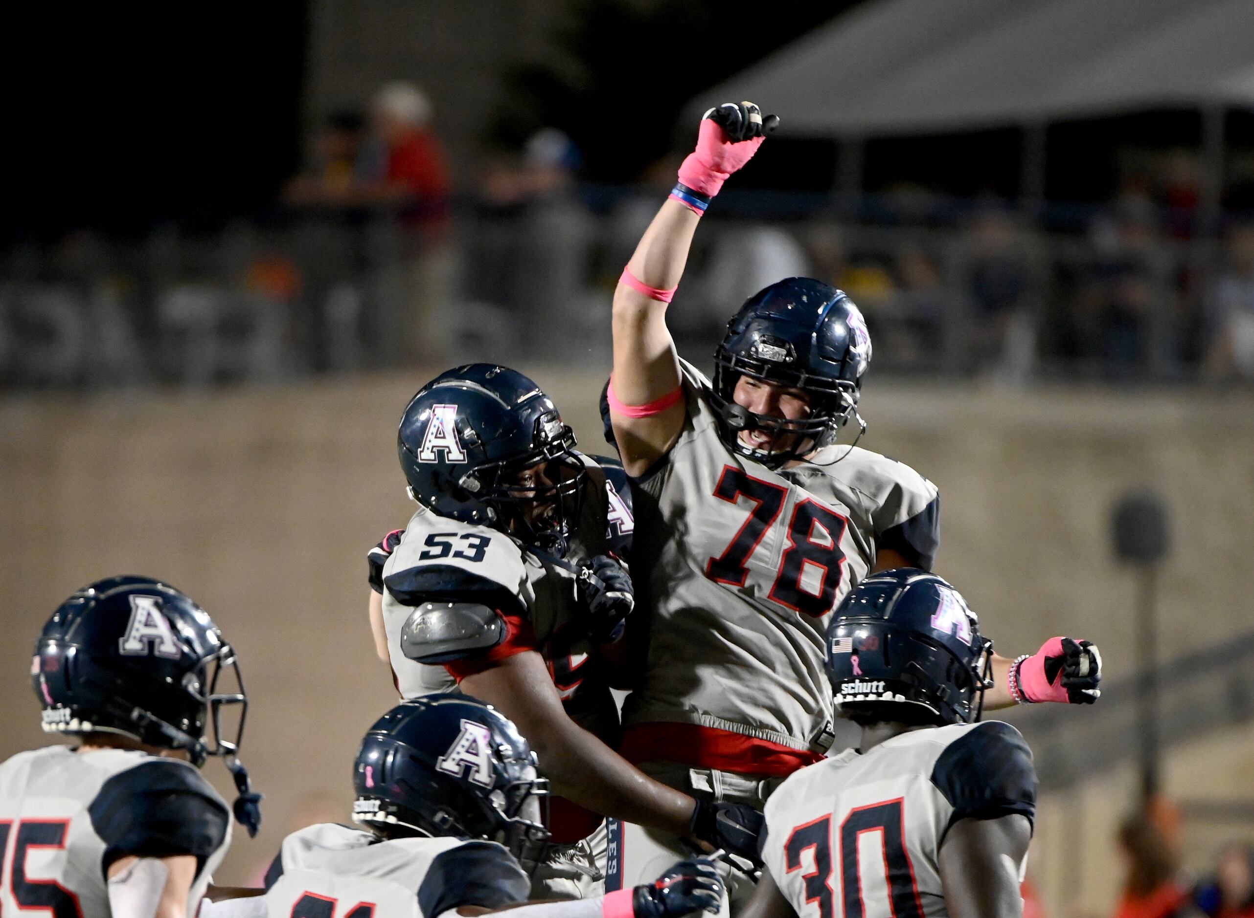 Allen’s AJ Lopez (78) celebrates with Jason Williams (53) after Williams fumble recovery in...