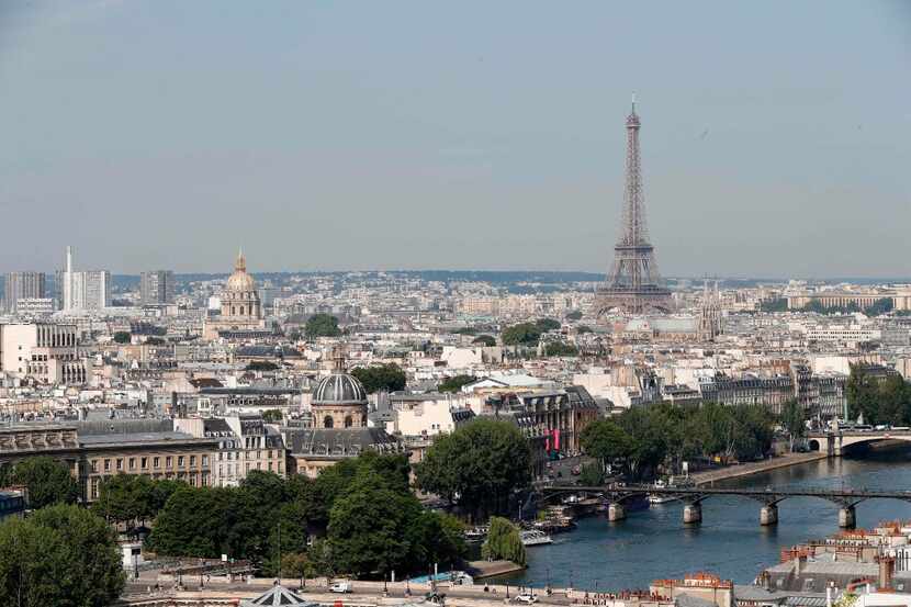 A view of Paris with the Eiffel Tower and the Seine River from the top of the Tour...
