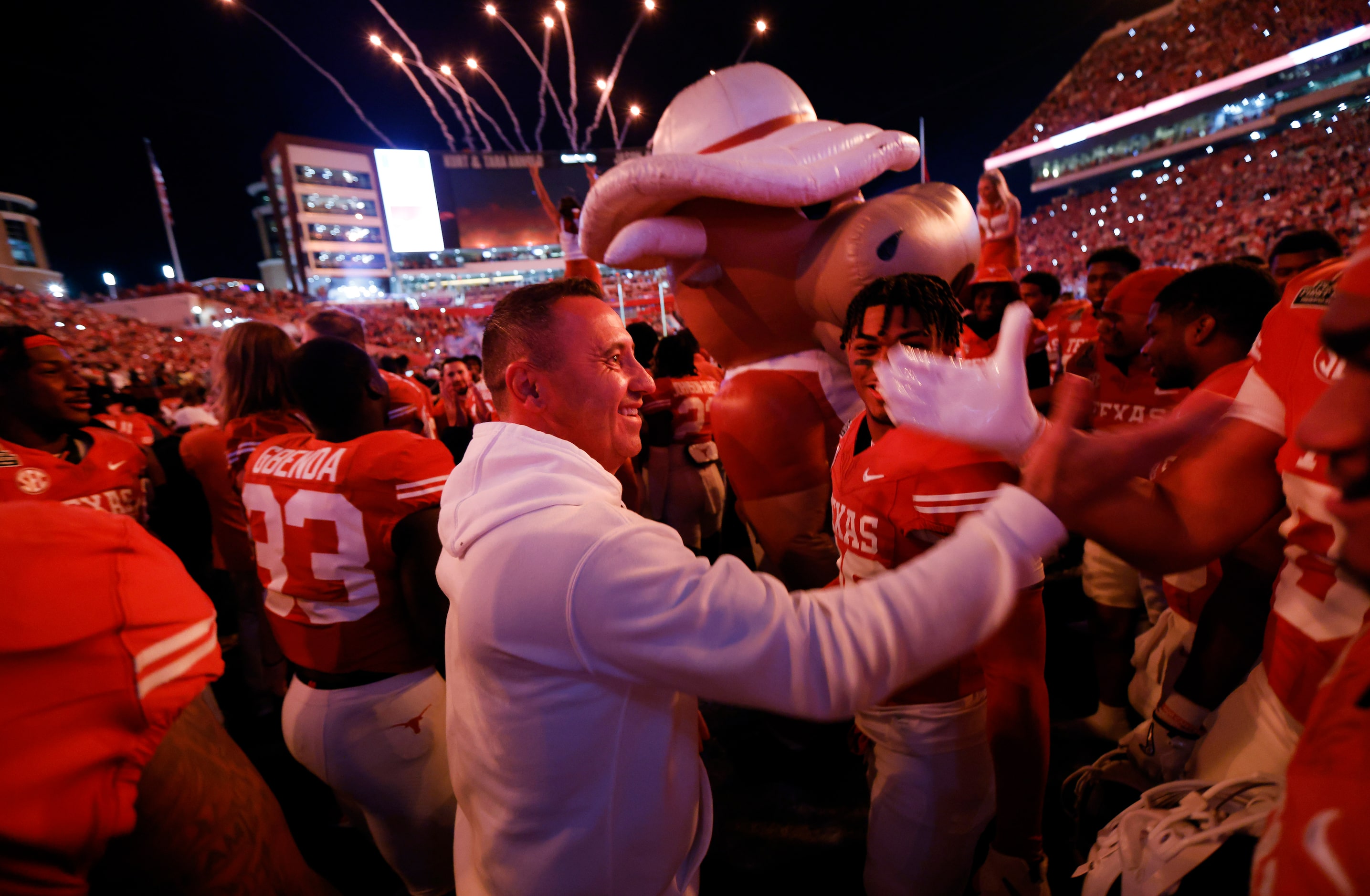 Texas Longhorns head coach Steve Sarkisian congratulates his players following their 38-24...