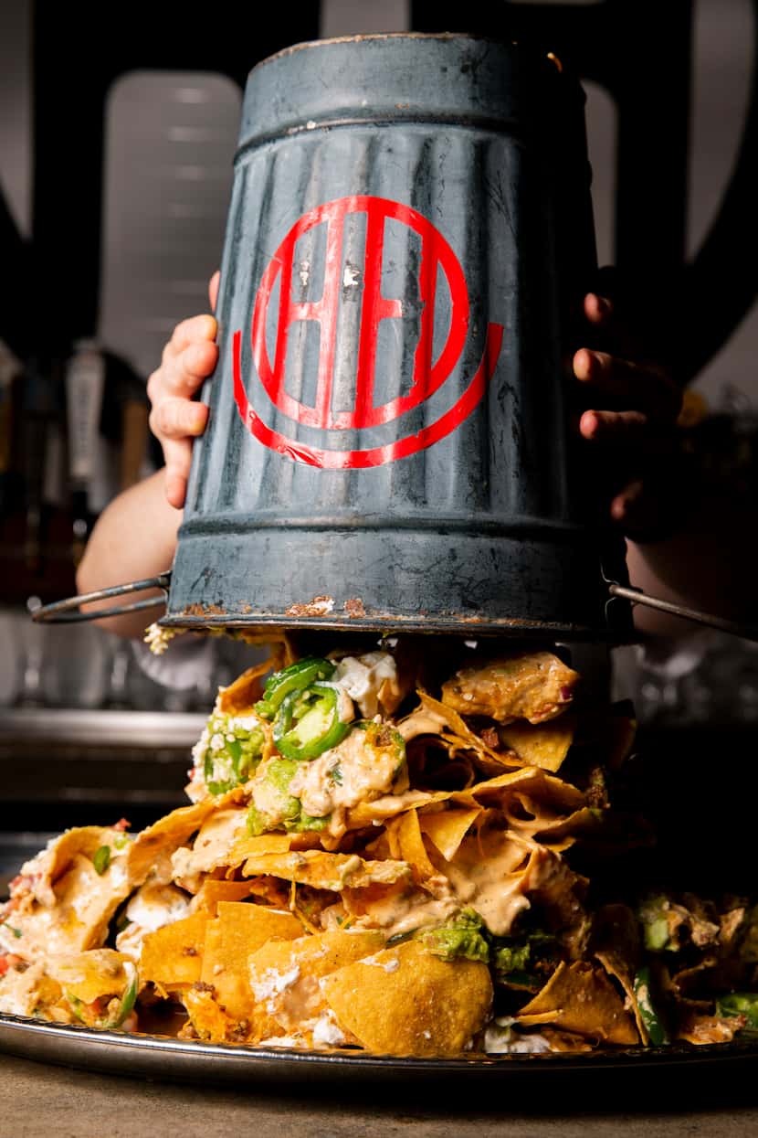 The nacho tower at Happiest Hour comes with chips, cheese, ground beef, guacamole and more,...