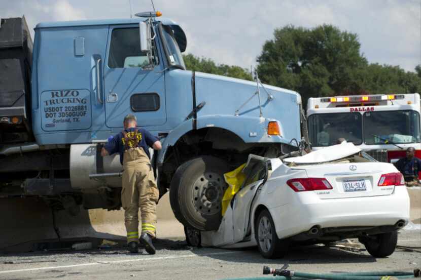 The car of an elderly couple from Trophy Club was crushed by a dump truck near Marsh Lane on...