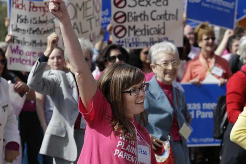 Katie Wolfe cheered during a Planned Parenthood rally on the steps of the Capitol in Austin...