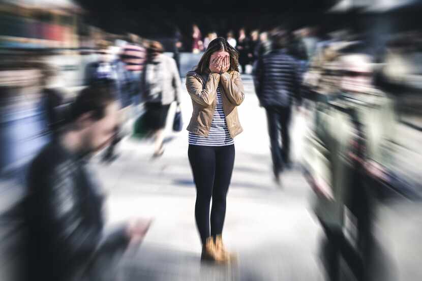 Panic attack in public place. Woman having panic disorder in city. Psychology, solitude,...