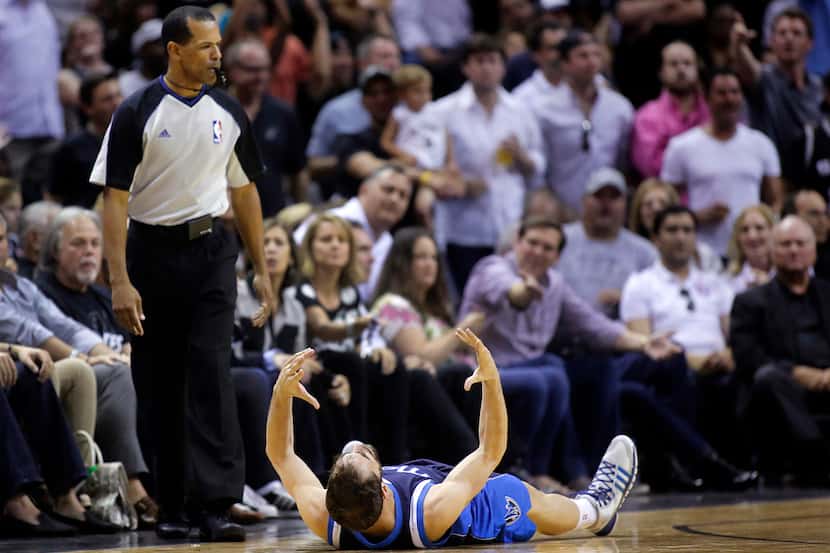 Dallas Mavericks guard Jose Calderon (8) reacts in frustration after the official didn't...
