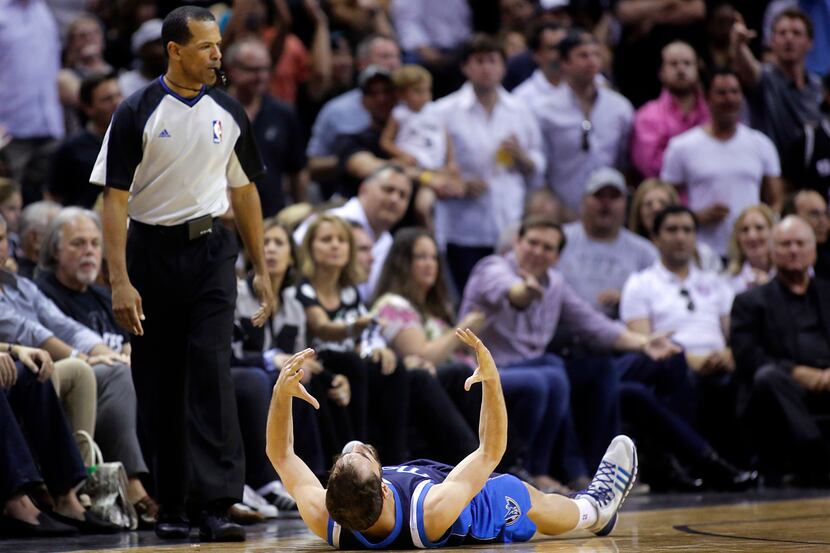 Dallas Mavericks guard Jose Calderon (8) reacts in frustration after the official didn't...