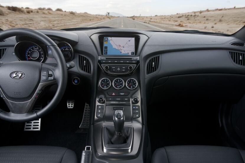 For an almost $33,000 car, the Genesis' interior wasn't that impressive, going heavy on the...