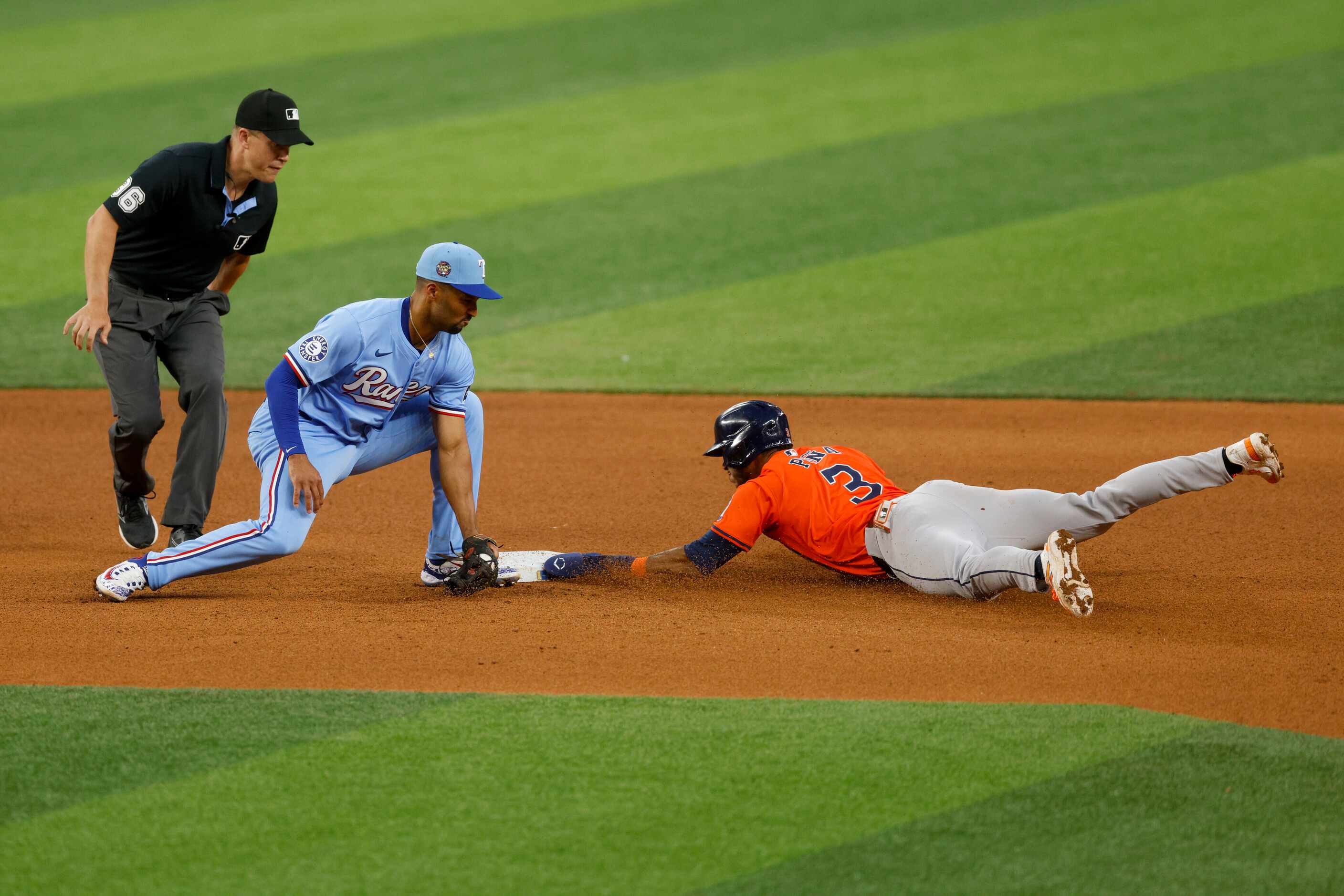 Houston Astros shortstop Jeremy Peña (3) safely steals second base ahead of the tag from...