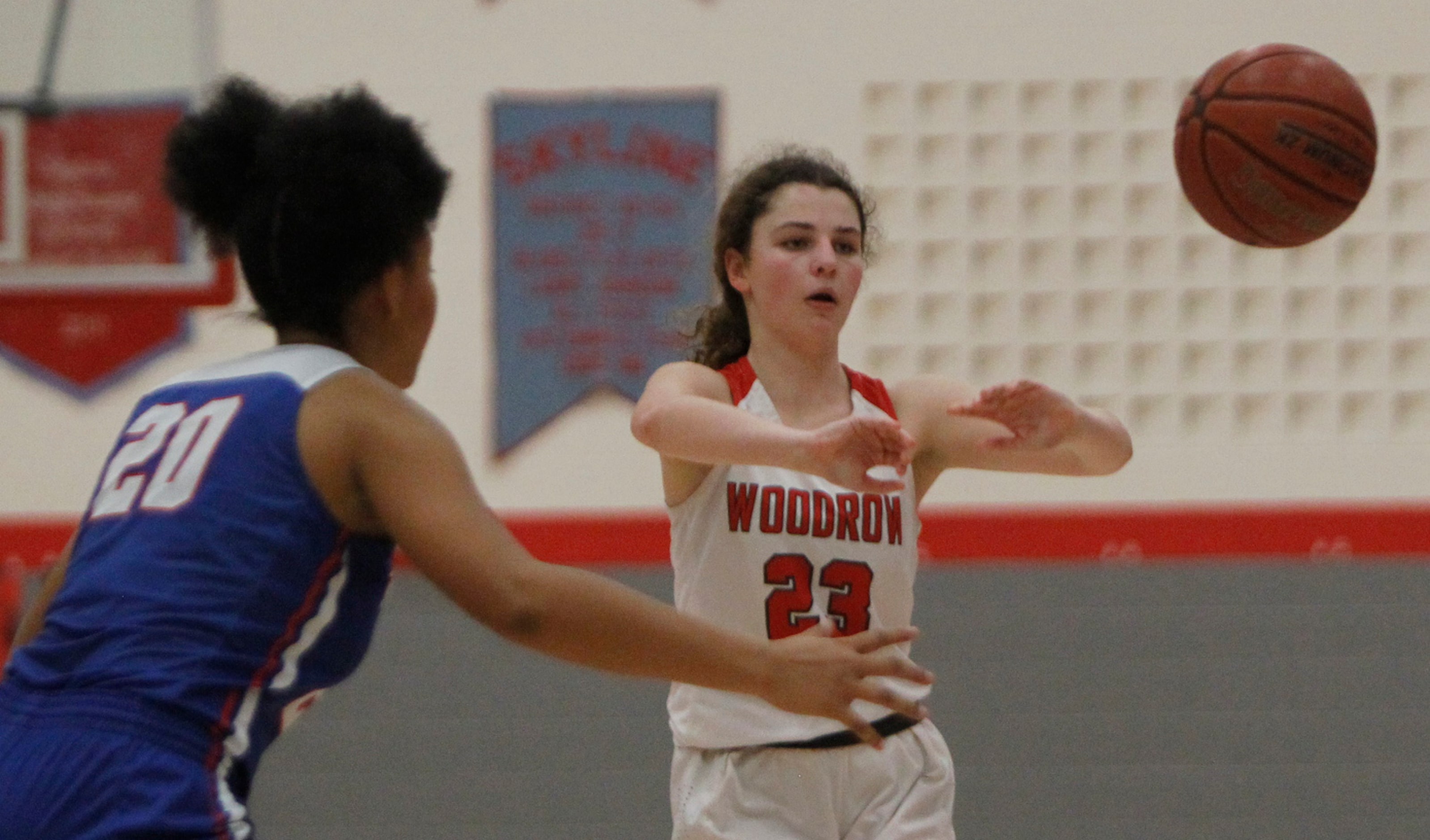 Dallas Woodrow's Abi Radcliffe (23) passes to a teammate away from the defense of Dallas...