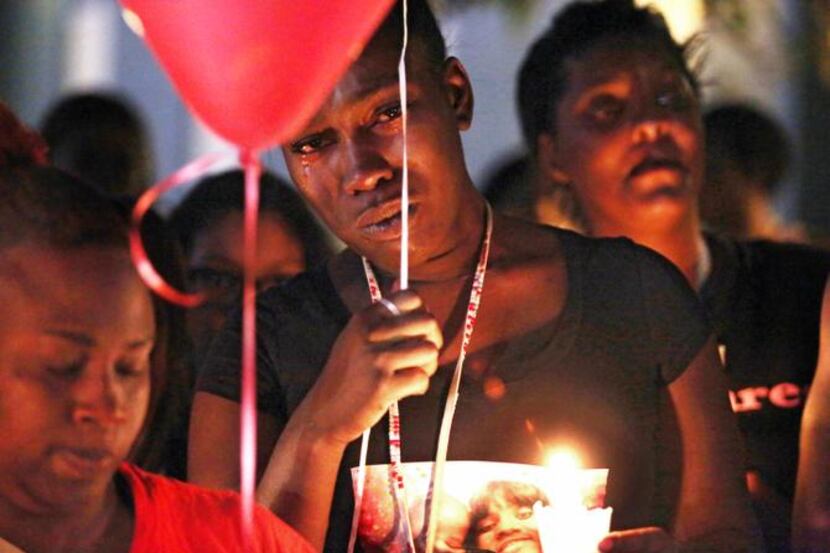
Naomi Thompson mourned the death of her friend, Marietta Shaw, at a candlelight vigil at...