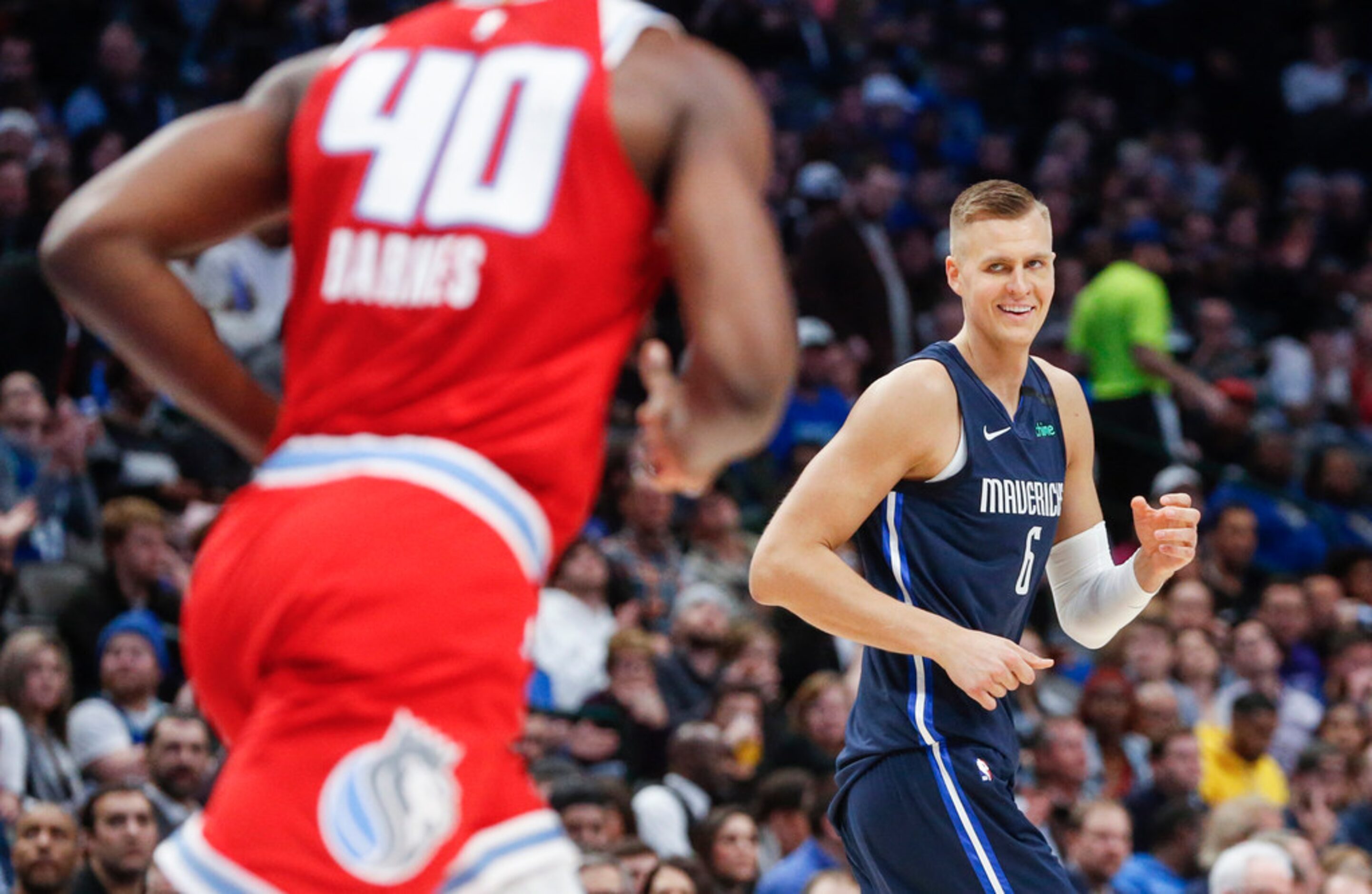 Dallas Mavericks forward Kristaps Porzingis (6) reacts after scoring during the second half...