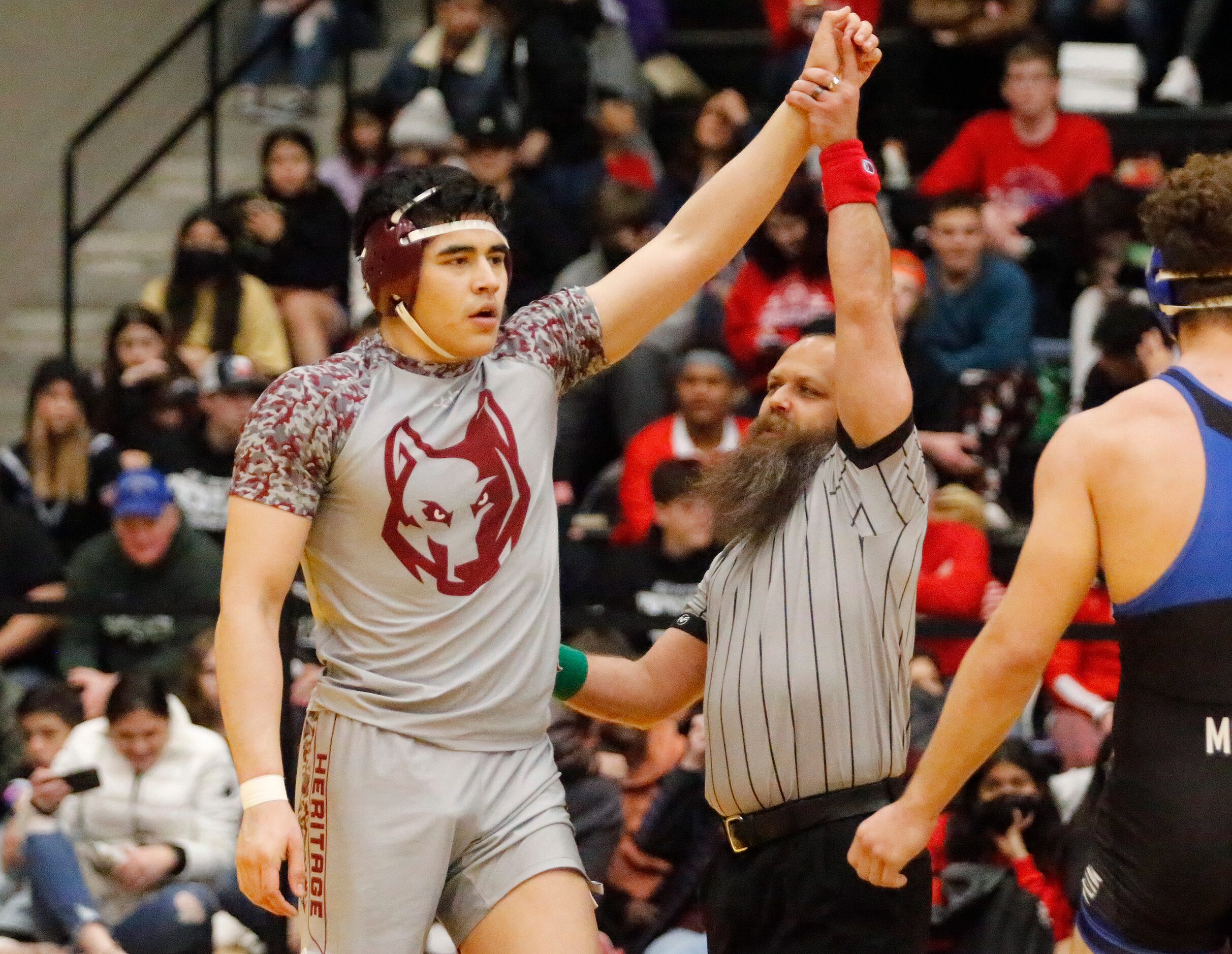 Alex Zavala of Frisco Heritage High School is announced the winner of  his 195 division...