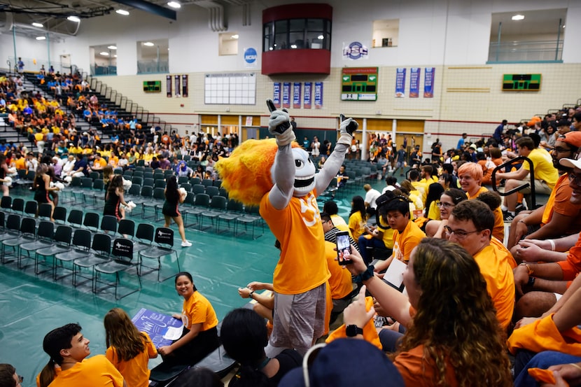 Temoc, the UTD mascot, leads a happy birthday sing-along for one of the freshman in...