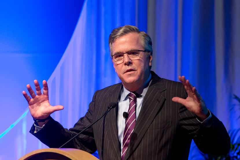 This Jan. 29, 2014 photo, former Florida Gov. Jeb Bush gestures as he speaks at the Inside...