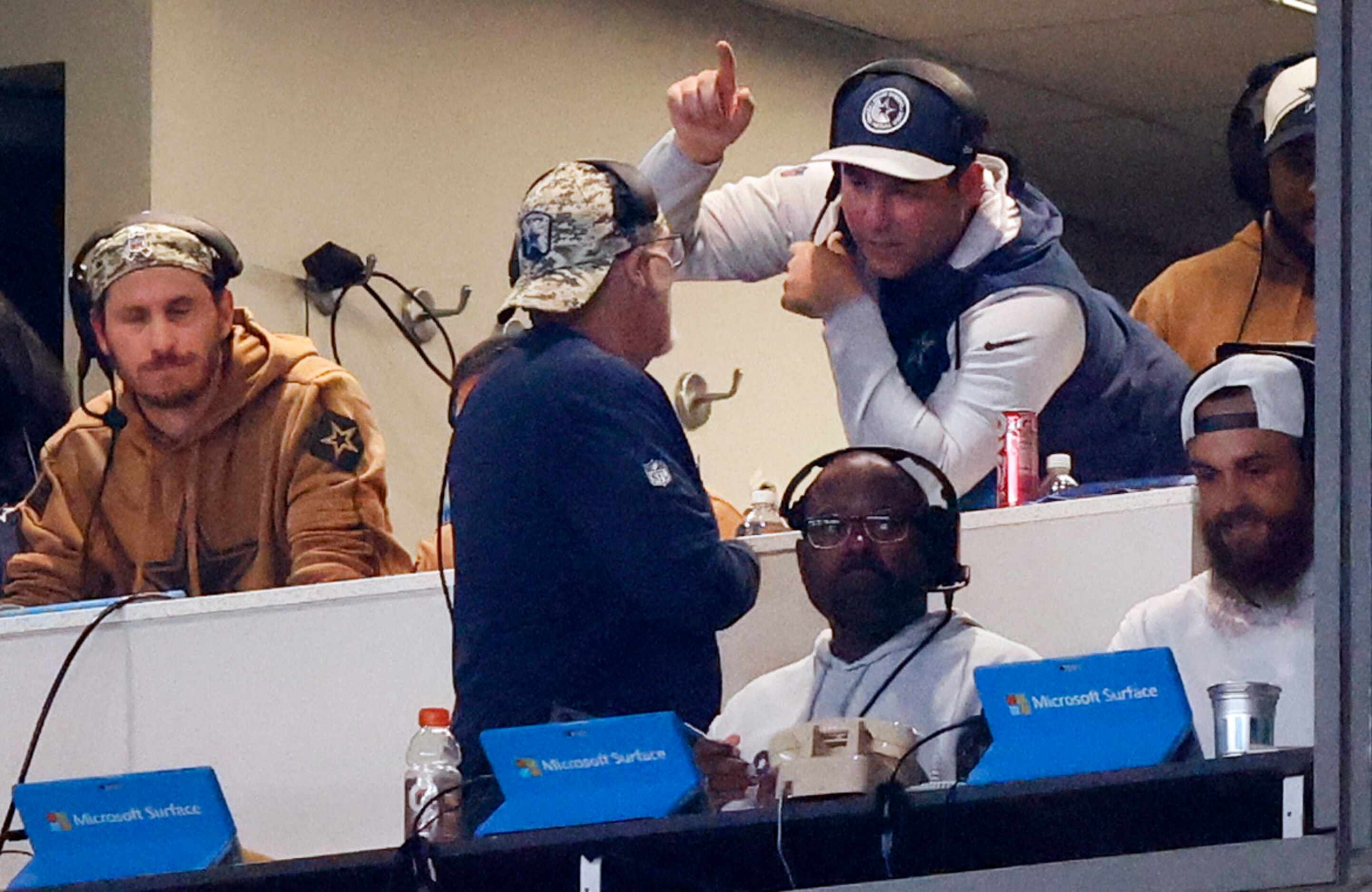 Dallas Cowboys defensive coordinator Dan Quinn (in dark blue shirt) confers with his staff...