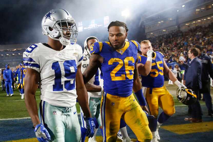 Dallas Cowboys wide receiver Amari Cooper (19) gets a pat on the back from Los Angeles Rams...