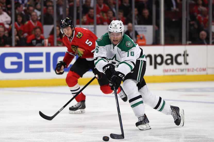 Ryan Garbutt #16 of the Dallas Stars chases the puck in front of David Rundblad #5 of the...