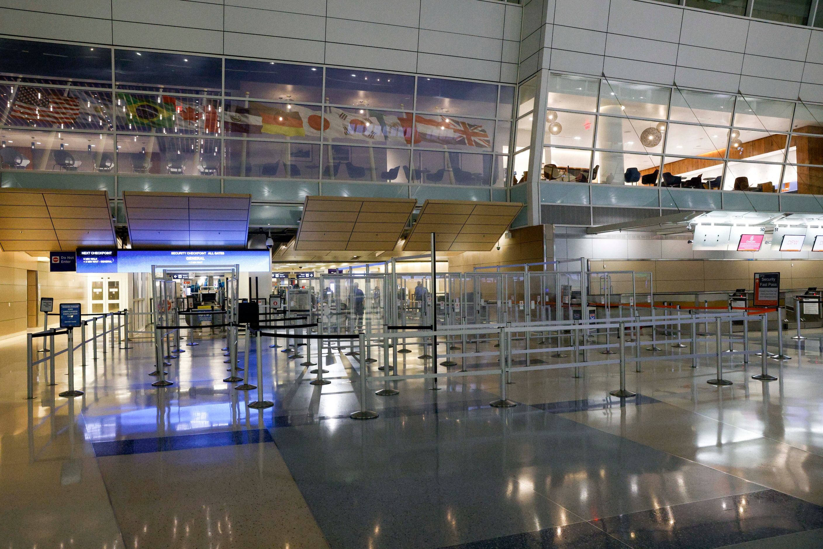 The TSA security checkpoint sits empty shortly after 4:30 a.m. in Terminal D at DFW...