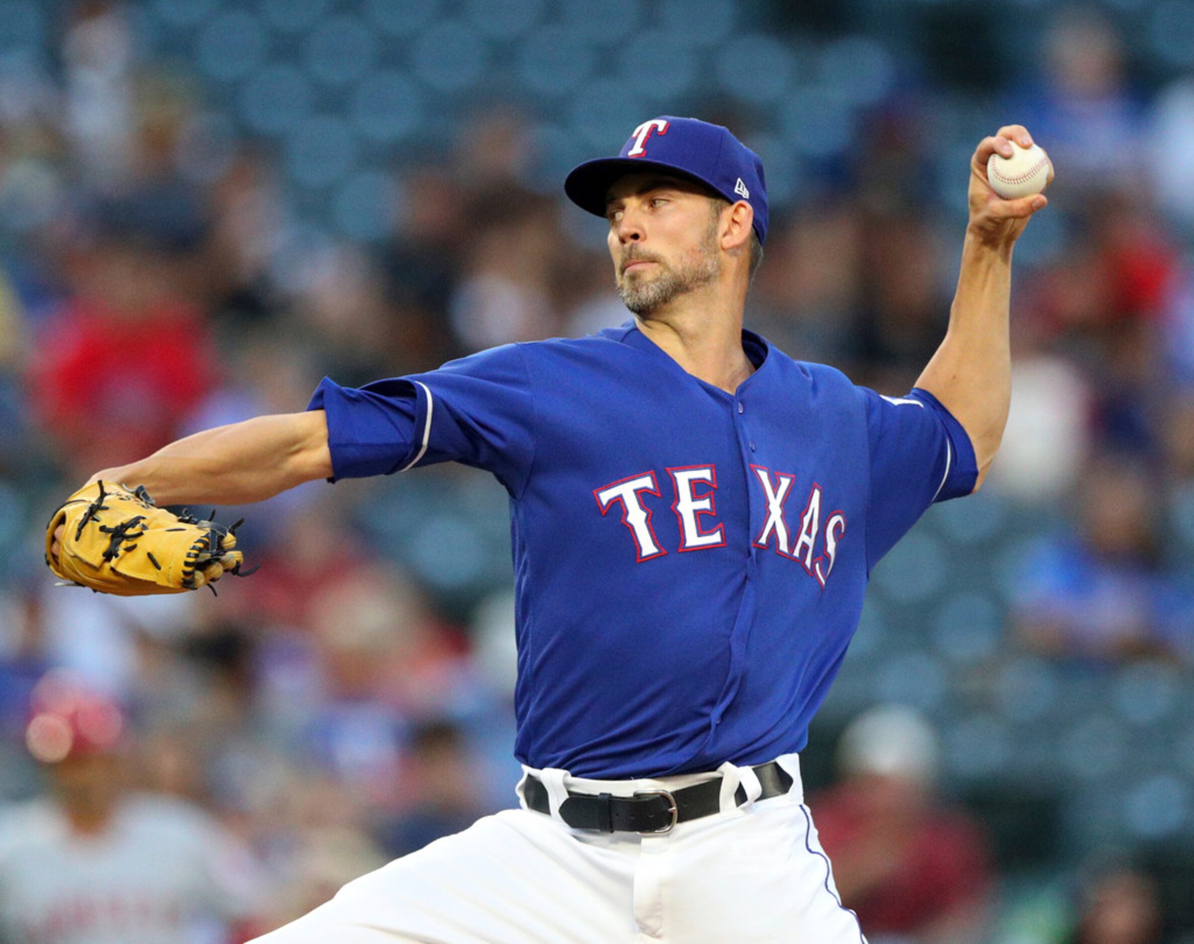 Texas Rangers starting pitcher Mike Minor (36) works the first inning of a baseball game...