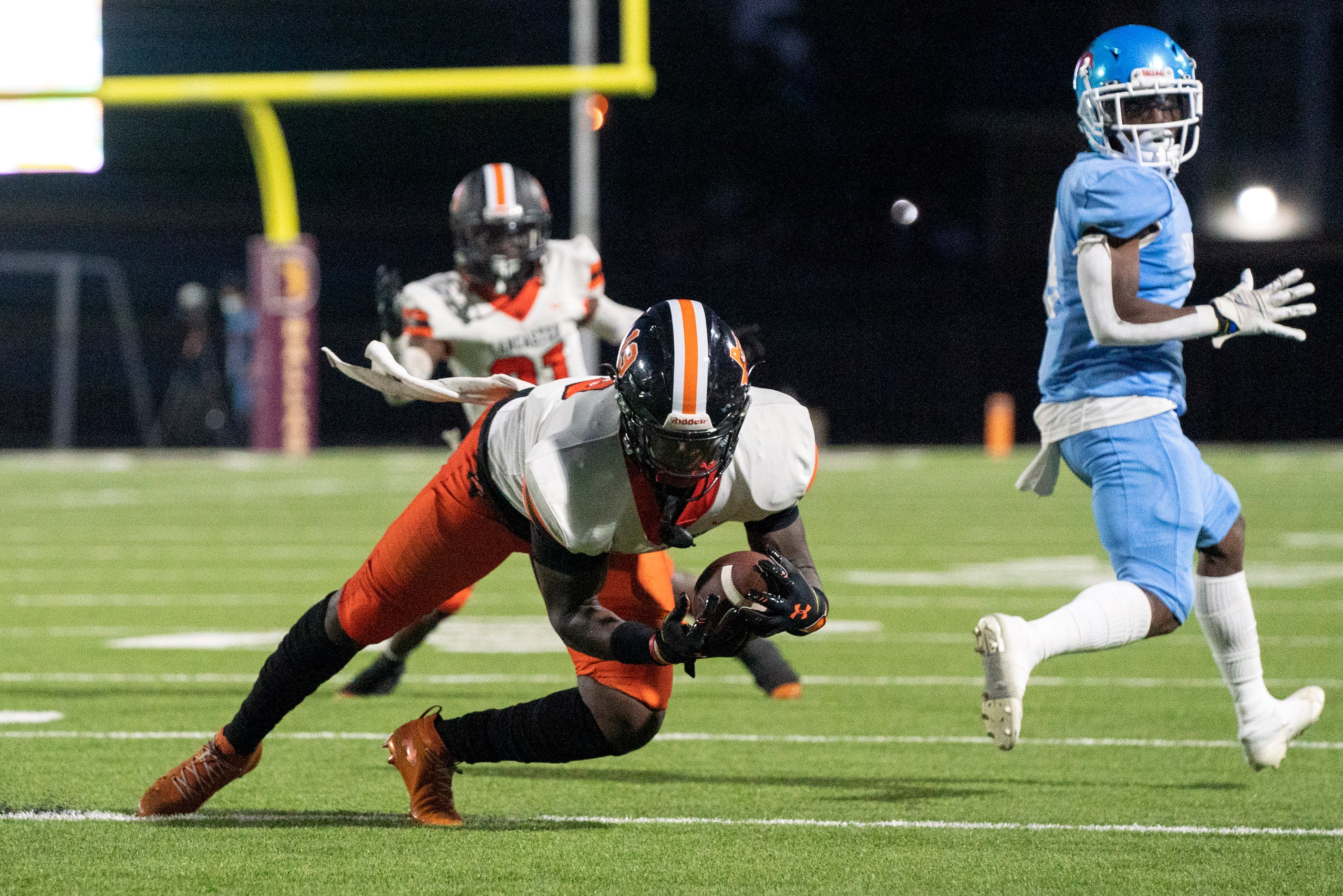 Lancaster linebacker Jarmarcus Piper (18) hauls in an interception during the first half of...